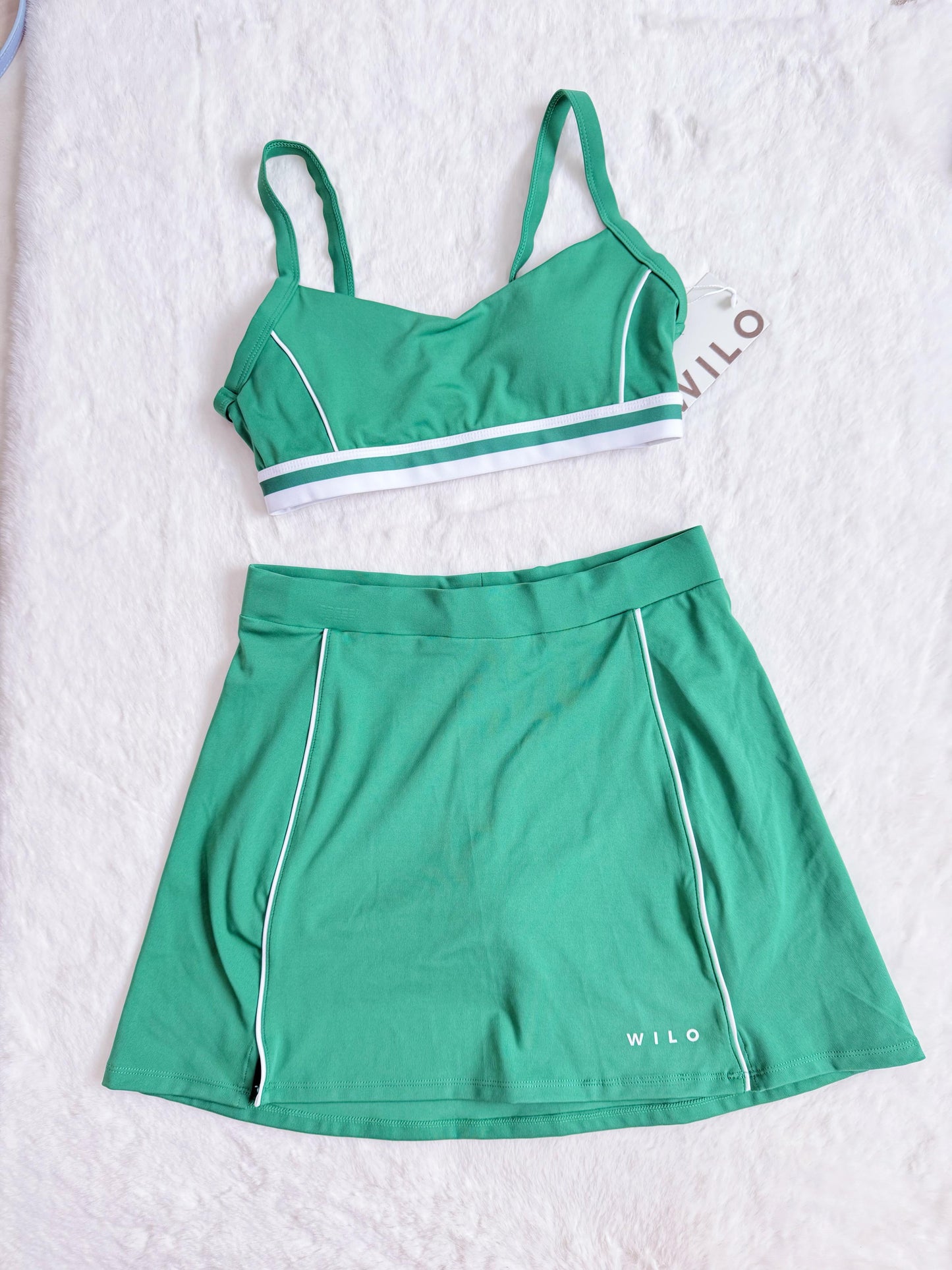 set deportivo top + falda / short