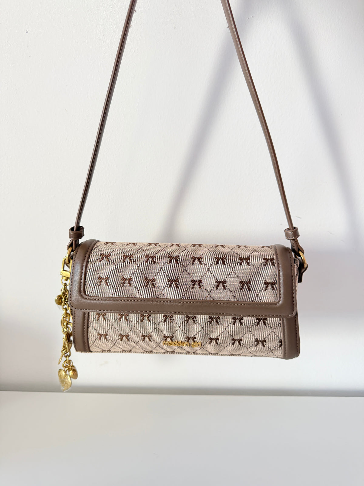 flap shoulder bag bows